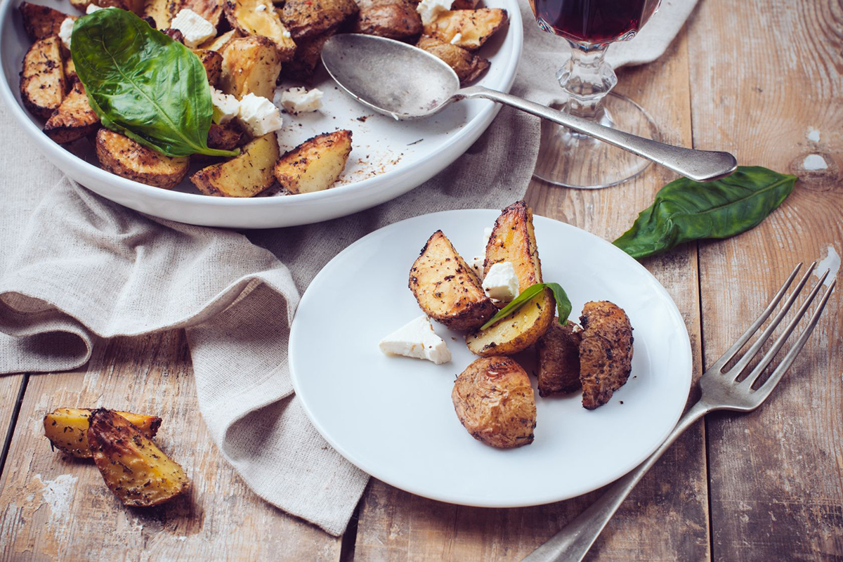 plate of roasted potatoes with skin on