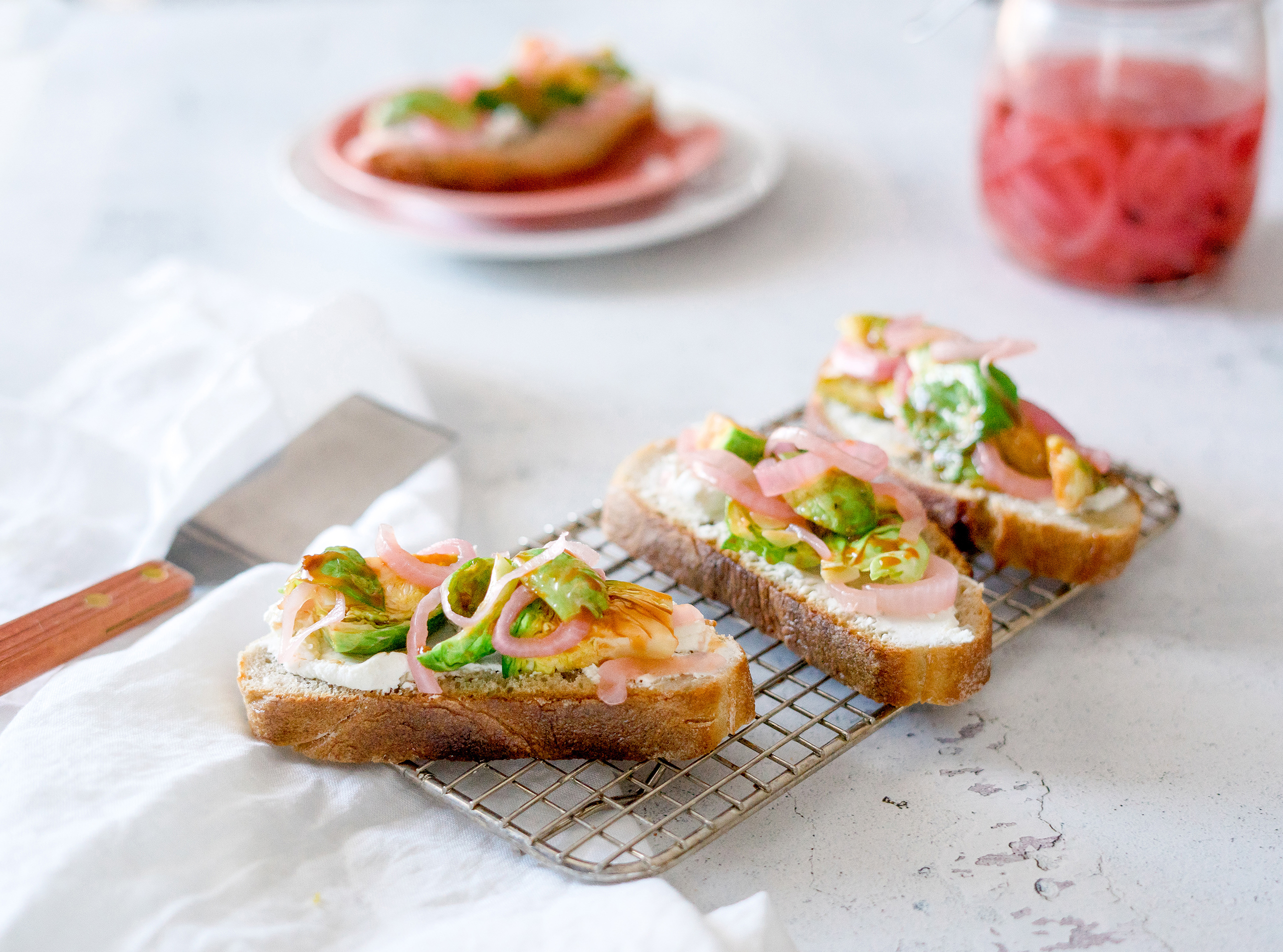 Brussels Sprout and Goat Cheese Crostini with Quick Pickled Red Onions